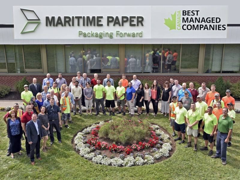The team at Maritime Paper assembles for a group photo in front of their Burnside location.