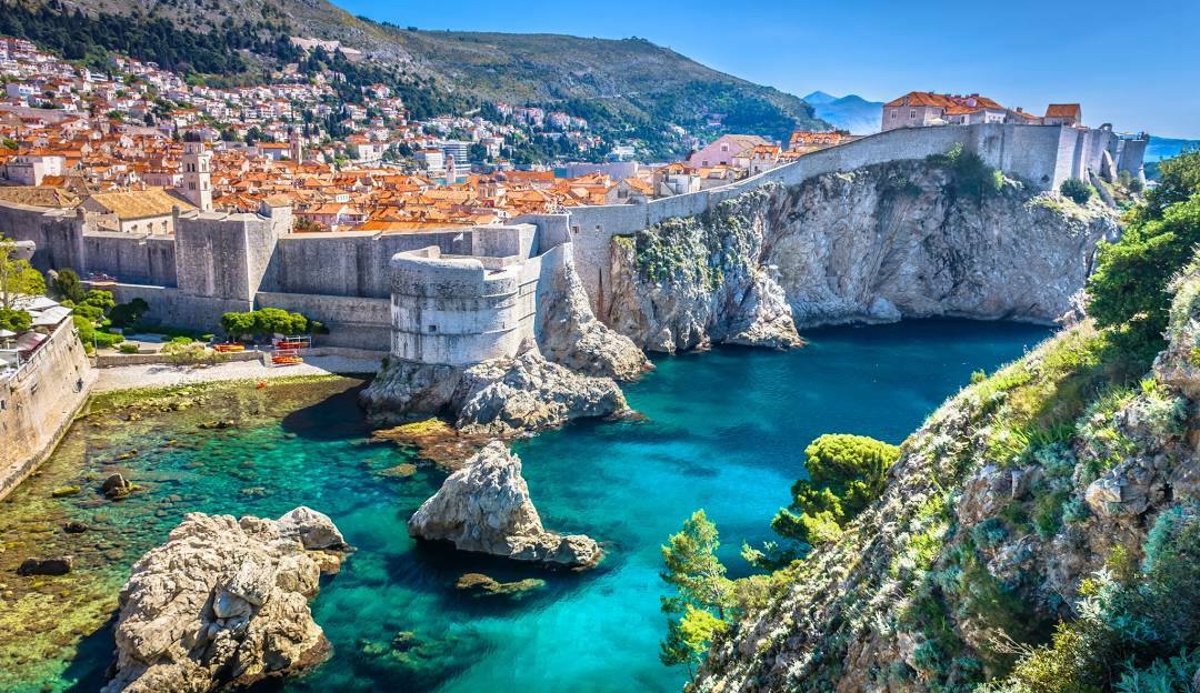 photo of croatia with ocean and rock wall