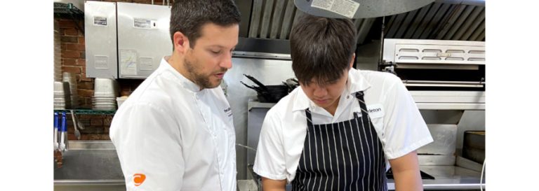 Mathias Probst and employee in kitchen