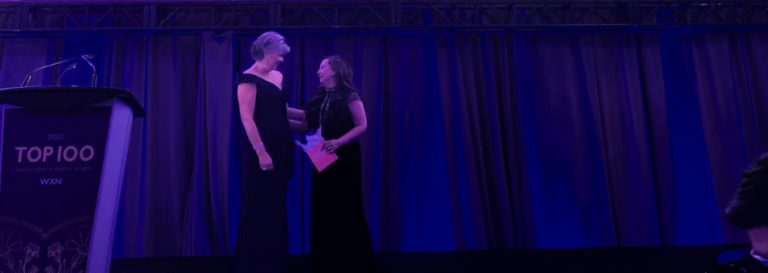 Faten Alshazly receiving award on stage