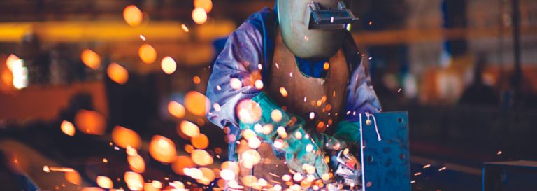 A welder in a welding mask