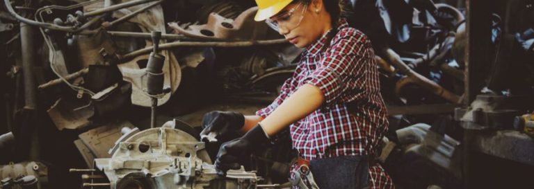 Woman working in a metal shop